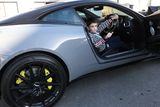 thumbnail: Alejandro looks perfectly at ease in the Aston Martin supercar.