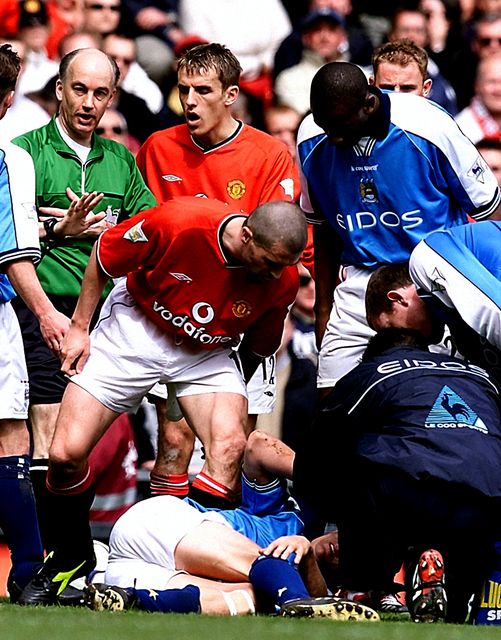 Roy Keane shouts at Manchester City’s Alf-Inge Haaland (on ground) after being shown a red card for a horror tackle in 2001 (Phil Noble/PA)