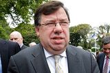 thumbnail: Taoiseach Brian Cowen stands in for the party photograph. Photo: Steve Humphreys