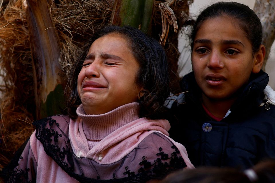 Children in tears following the death of Palestinians in Israeli strikes at Rafah’s Abu Yousef Al-Najjar Hospital in the southern Gaza Strip. Photo: Reuters