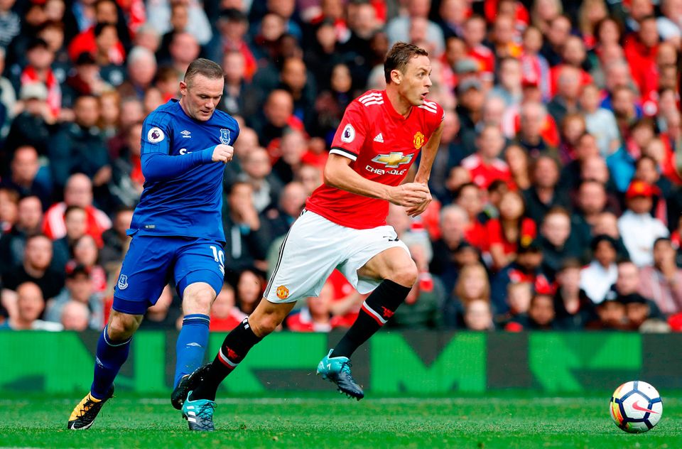 Everton's Wayne Rooney catches Manchester United's Nemanja Matic on the heel. Photo credit: Martin Rickett/PA Wire