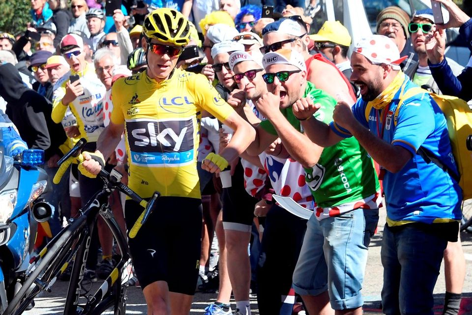 Chris Froome running up Mont Ventoux after an accident caused by the vastness of the crowds had damaged his bike beyond use. Photo: Bernard Papon
