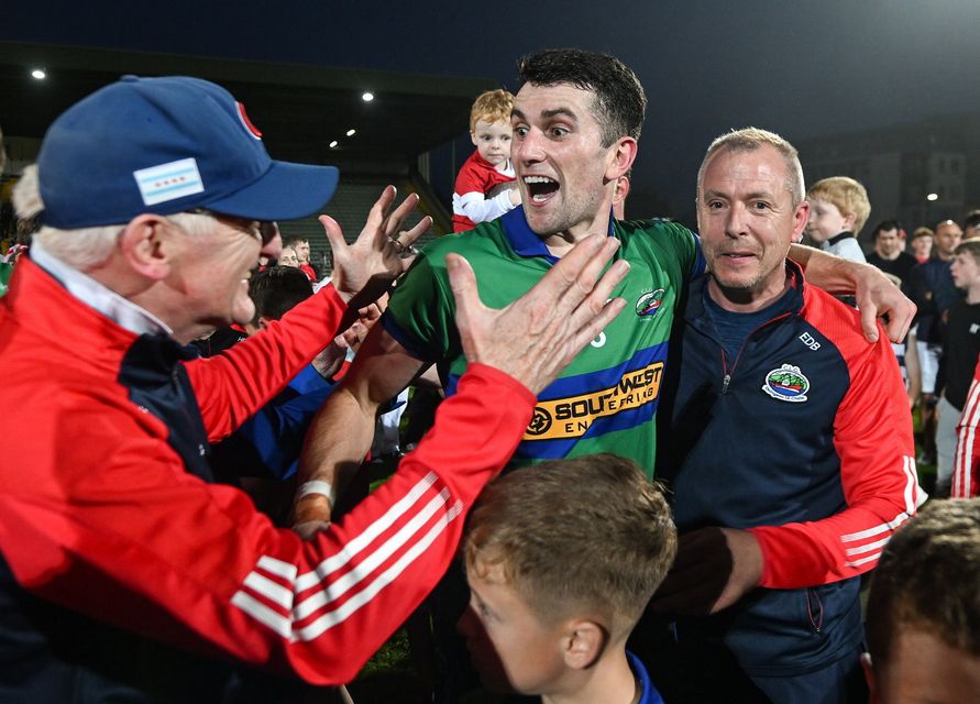 Mark O'Connor, centre, is congratulated after the Kerry County Senior Football Championship Final Photo by David Fitzgerald/Sportsfile