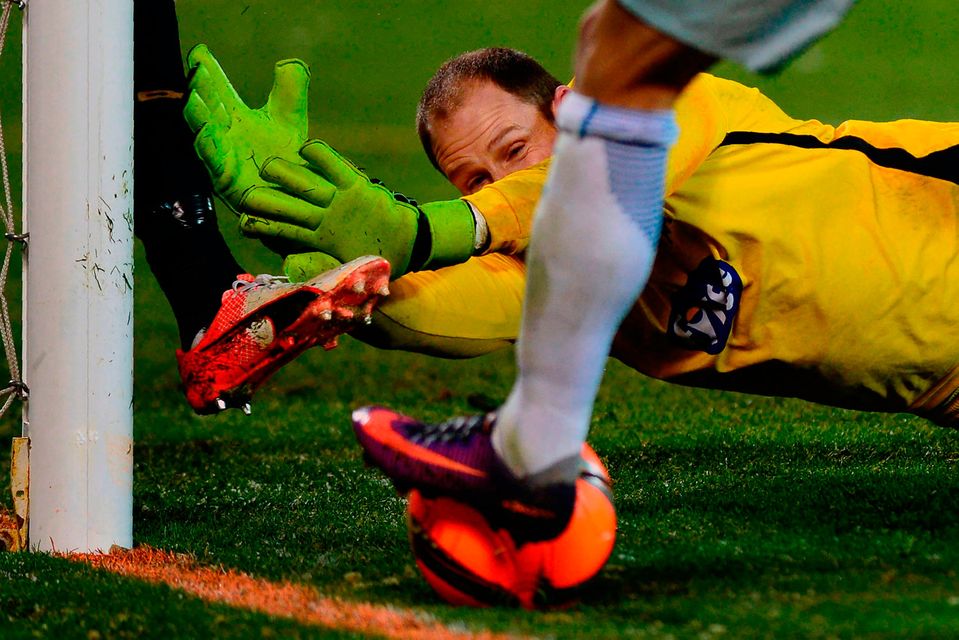Dundalk goalkeeper Gary Rogers dives at the feet of a Zenit player moments before the home side scored their winning goal in Saint Petersburg last night. Photo: AFP/Getty Images