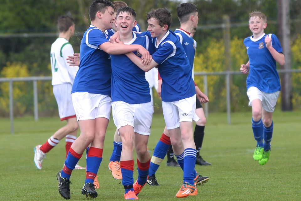 19/05/15. Goalscorer Dylan Reilly is congratulated by teammates during the Under 15s soccer final between Colaiste Phadraig CBS and Templeouge College at Peamount Utd.
Pic: Justin Farrelly.