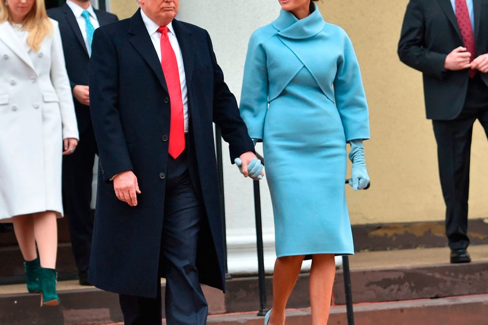 US President-elect Donald Trump and his wife Melania leave St. John's Episcopal Church on January 20, 2017, before Trump's inauguration.
