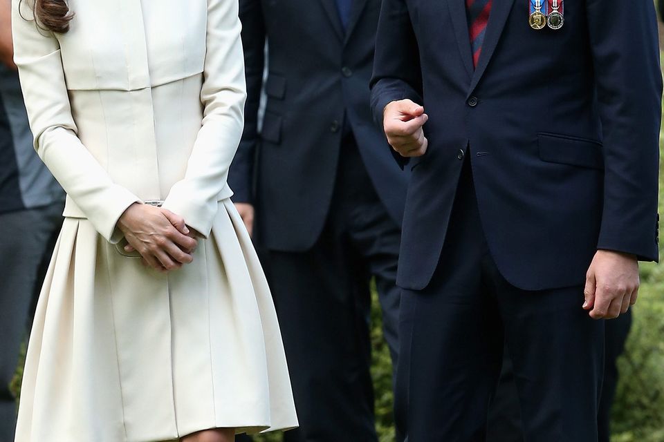 August 2014: Kate stunned in this cream coat dress by Alexander McQueen and complementary fascinator by Jane Taylor and her trusty LK Bennett nude heels
