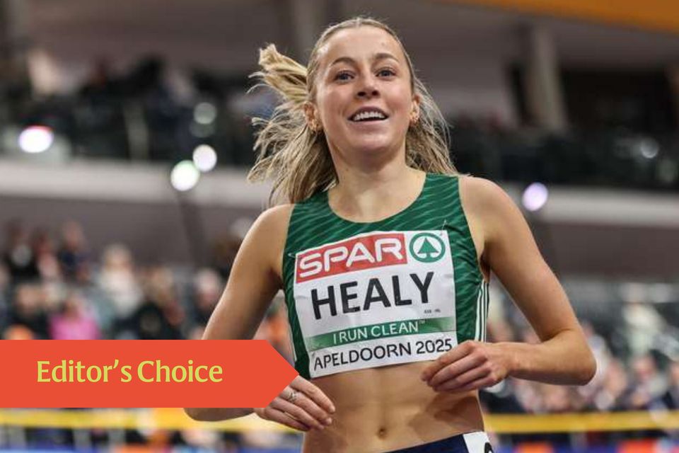 Sarah Healy celebrates after crossing the finish line to win in the women's 3000m final during the European Indoor in Apeldoorn
