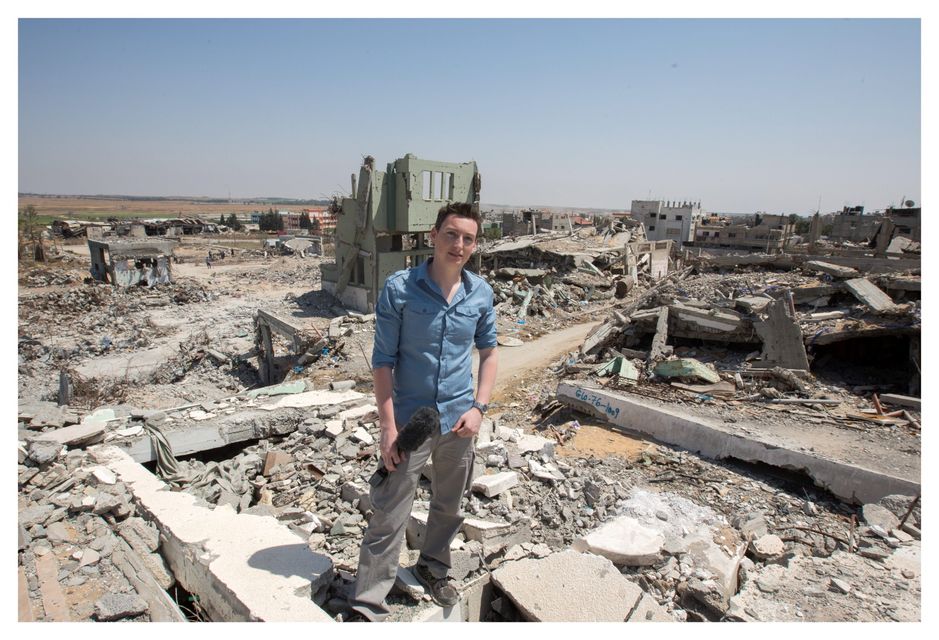 Irish Independent News Editor Kevin Doyle at the site of a bombed out village on the outskirts of Gaza City. Photo: Mark Condren