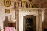 thumbnail: The curved fireplace and walls of the boudoir off the bedroom