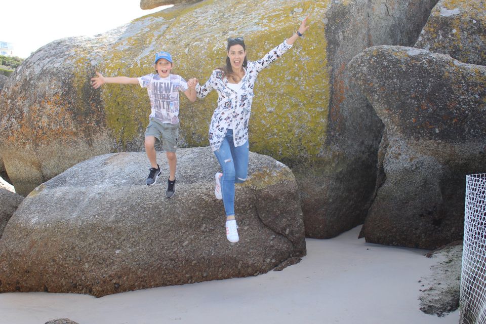 Jumping for joy at Boulders Beach, where we saw the penguins, just off the plane and ready for adventure