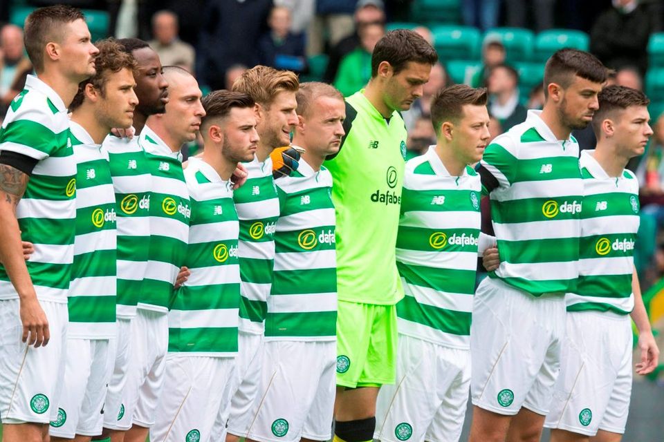 Celtic’s players pay tribute to those murdered in the Nice attack during a minute’s silence before Saturday’s match against Wolfsburg at Parkhead. Photo: Jeff Holmes/PA Wire