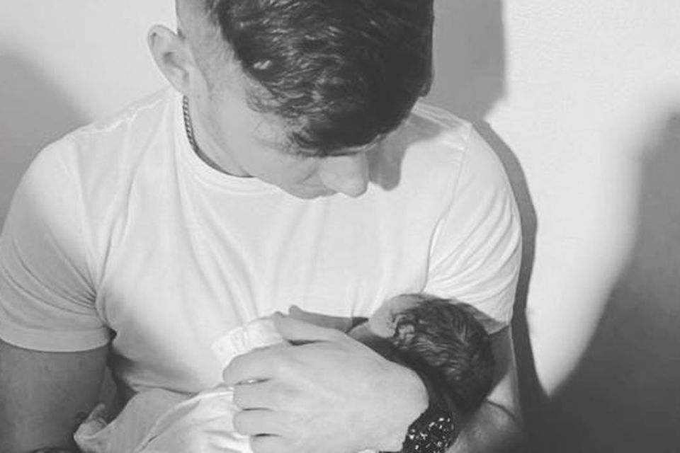 Jack Keating with his new baby. Photo: Jack Keating/Instagram