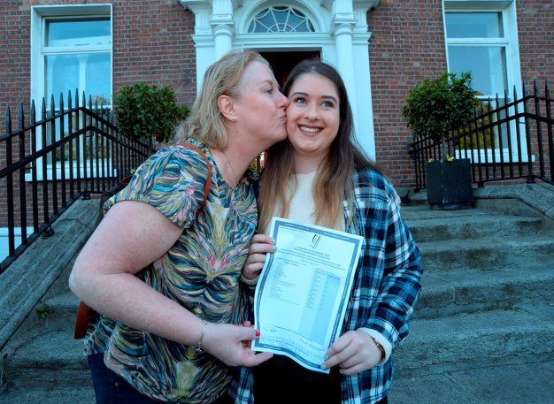 12 Aug 2015:   Hayley Briody, 17, from Drumree, Co. Meath, gets a kiss from her mother Shelia after receiving her Leaving Cert results (and 595 points). Loreto College, St. Stephen's Green, Dublin. Picture: Caroline Quinn