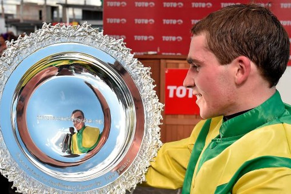 29 July 2015; Jockey Jonathan Burke admires thetote.com Galway Plate 2015 after winning the thetote.com Galway Plate on Shanahan's Turn. Galway Racing Festival, Ballybrit, Galway. Picture credit: Cody Glenn / SPORTSFILE