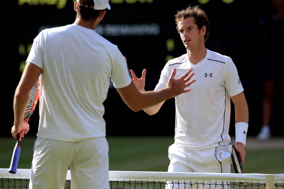Andy Murray (right) and Ivo Karlovic shake hands after their match during day Seven of the Wimbledon Championships at the All England Lawn Tennis and Croquet Club