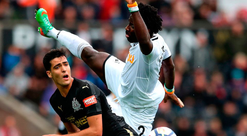 Newcastle United's Henri Saivet (left) and Swansea City's Wilfried Bony (right) battle for the ball. Photo credit: Nick Potts/PA Wire
