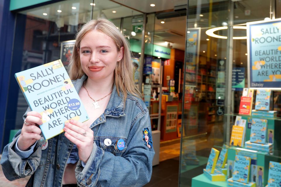 Emily Carruthers with her copy of Sally Rooney's Beautiful World, Where Are You outside Dubray books on Grafton Street. Photo: Gerry Mooney