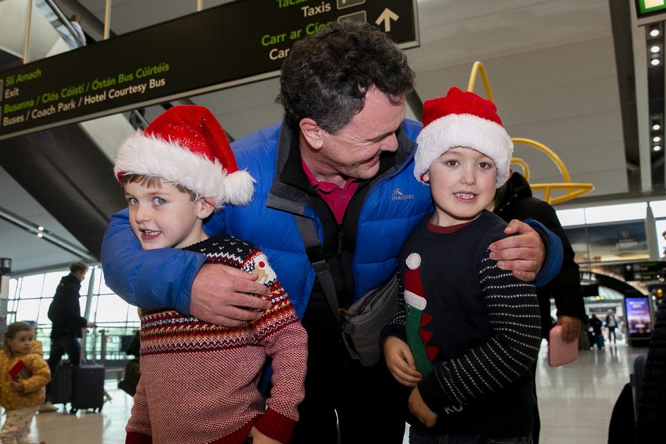 Damien Rossi from Brisbane Australia greets nephews Leo Rossi (7) from Clontarf and Dillon Rossi (6) from Clontarf at Dublin Airport. Photo: Gareth Chaney/ Collins Photos