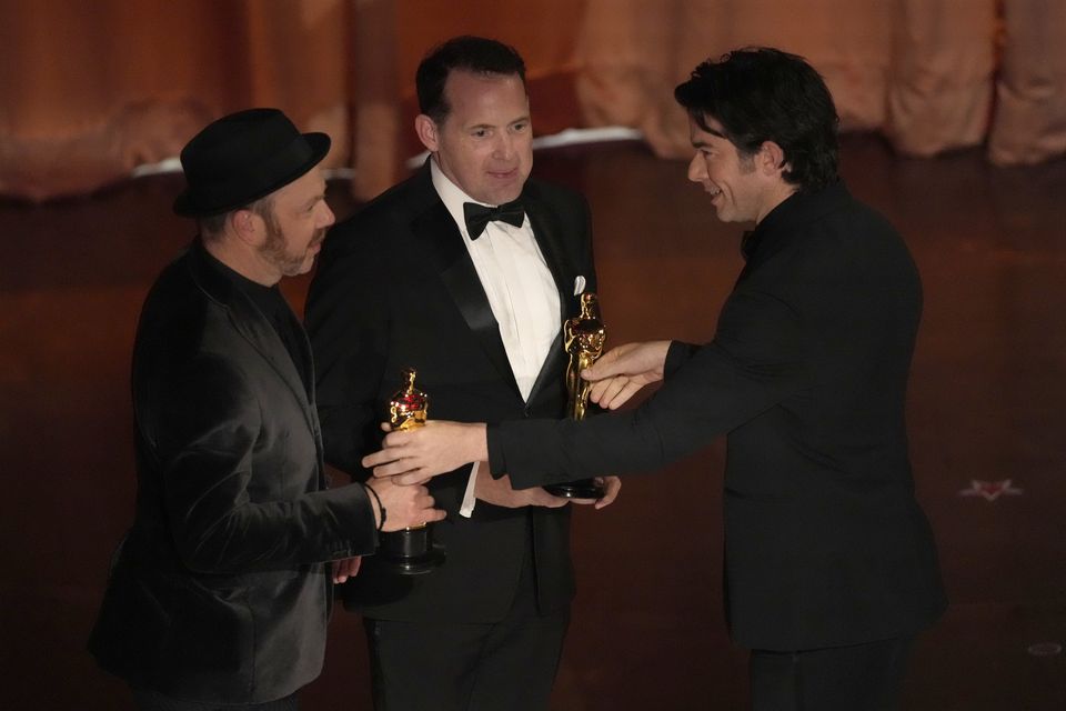 John Mulaney (right) presented the award for best sound at the Oscars (Chris Pizzello/AP)