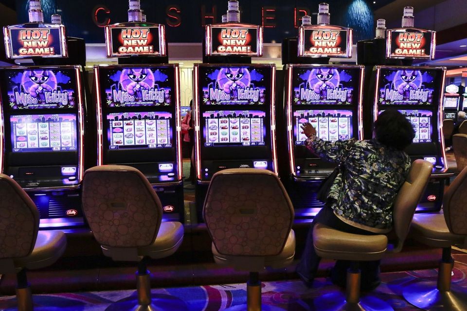 A gambler plays the slots at a casino (AP)