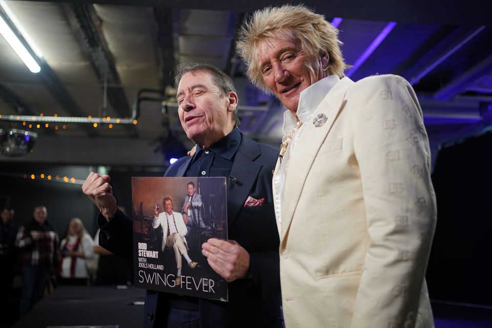 Jools Holland and Rod Stewart during a signing session for their collaborative studio album, Swing Fever (Yui Mok/PA)