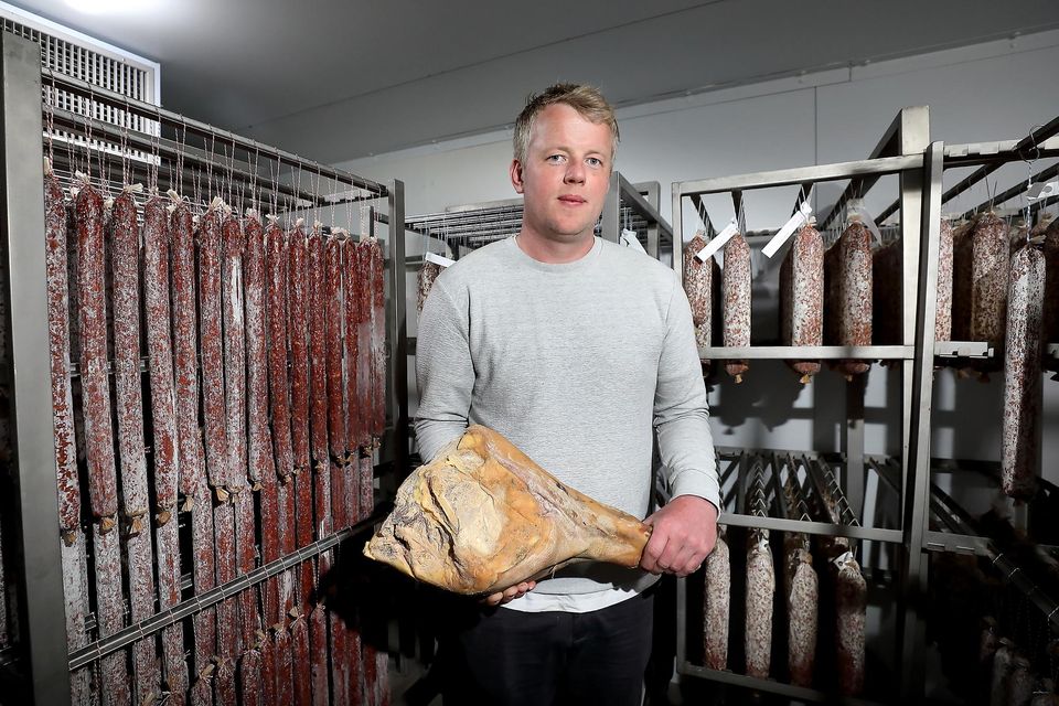 Flavour: Eoin Bird with some salamis and chorizo and other meats in the curing/drying room at his Wooded Pig farm at Edoxtown near Tara, Co Meath. Photos: Frank McGrath