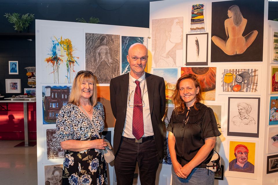 Ray Finucane (centre), with graduates Teresa Mulvaney, and Monika Kowalska of Claggyart.