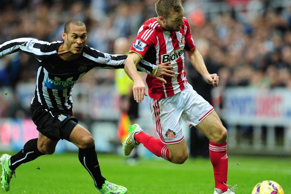 Sunderland midfielder Seb Larsson strides away from Newcastle United's Yoan Gouffran during their Premier League clash at St James' Park. Photo: Stu Forster/Getty Images