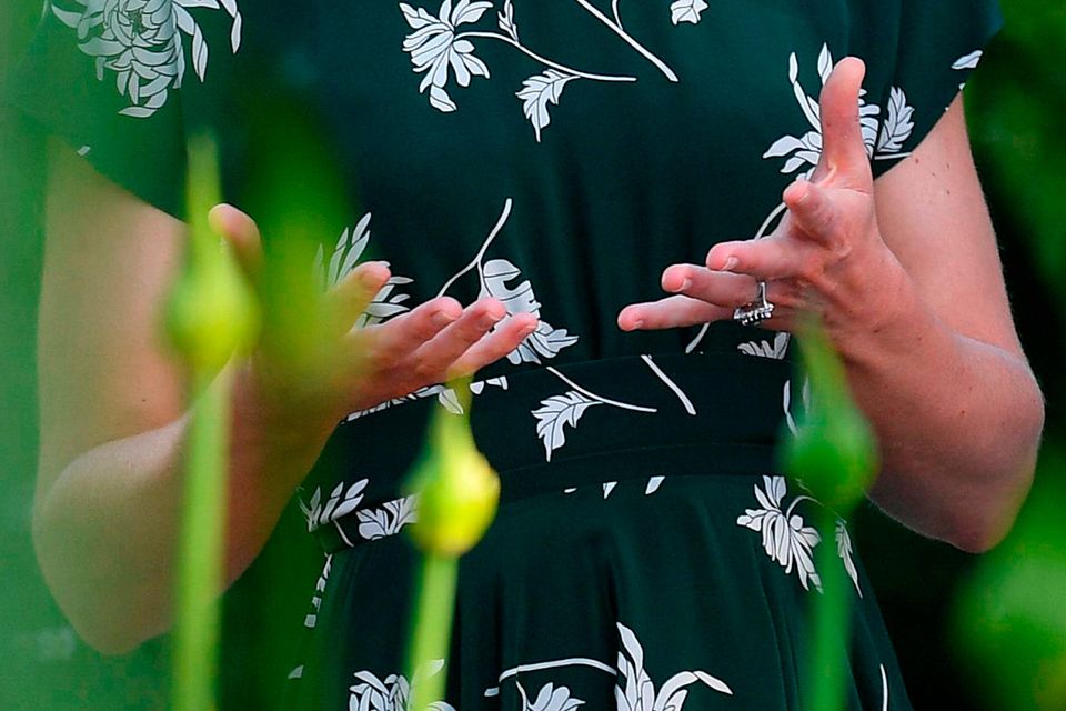 Britain's Catherine, Duchess of Cambridge gestures as she talks with Northern Irish designer Ian Price (unseen) at his garden 'Mind Trap' at the Chelsea Flower Show in London on May 22, 2017