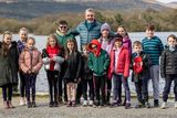 thumbnail: Retiring Principal of Gaelscoil Faithleann Proinsias Mac Curtain pictured with his students at Ross Castle on Saturday morning, prior to their departure to Innisfallen Island for a Mass and Farewell event, organised by the parents of the school. Photo by Tatyana McGough