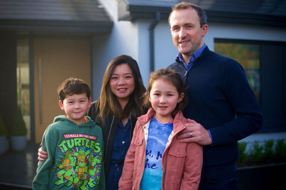Rebecca and Eamonn with their two children outside their home in Offaly on Home of the Year