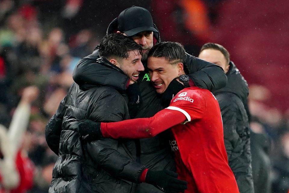 Liverpool manager Jurgen Klopp (centre) celebrates with Dominik Szoboszlai (left) and Darwin Nunez (right) after the last-gasp win against Fulham (Peter Byrne/PA)