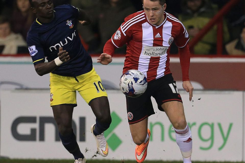 Sheffield United goalscorer Marc McNulty gets away from Southampton's Sadio Mane during their Capital One Cup quarter-final clash at Bramall Lane. Photo: Lynne Cameron/PA Wire