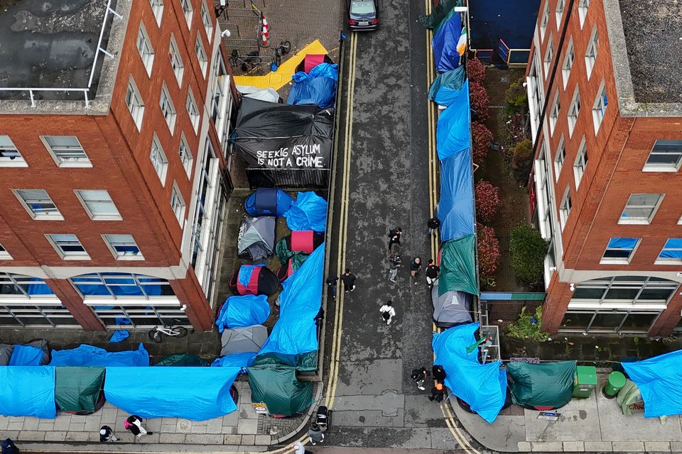 Tents housing asylum seekers near to the Office of International Protection in Dublin (Niall Carson/PA)