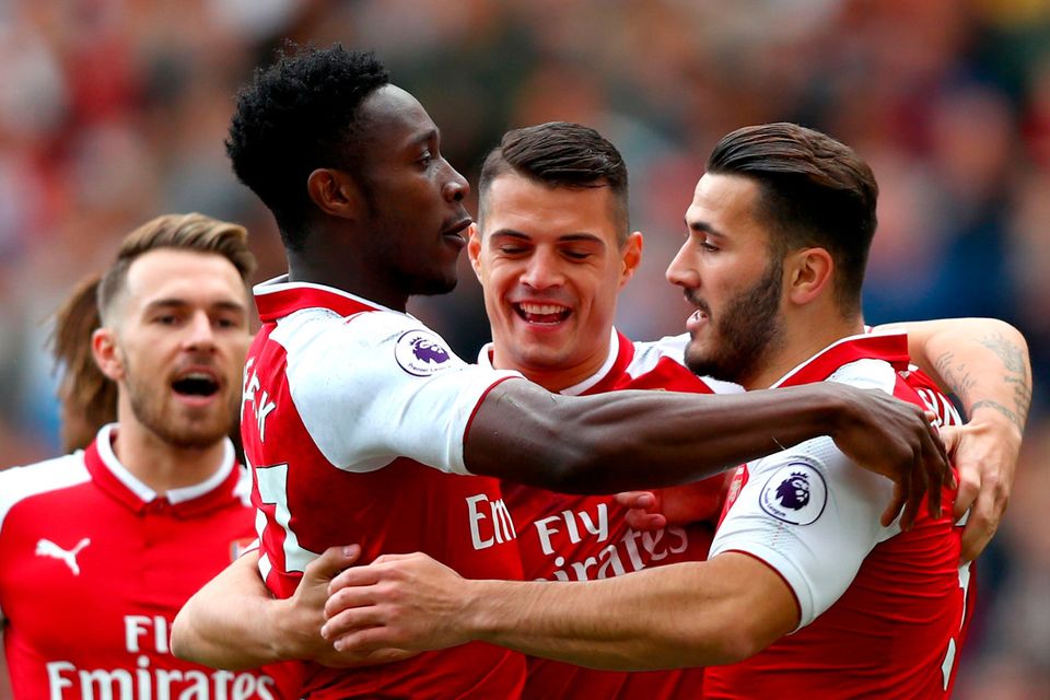 LONDON, ENGLAND - SEPTEMBER 09:  Danny Welbeck of Arsenal celebrates scoring his sides first goal with Granit Xhaka of Arsenal and Sead Kolasinac of Arsenal during the Premier League match between Arsenal and AFC Bournemouth at Emirates Stadium on September 9, 2017 in London, England.  (Photo by Clive Rose/Getty Images)