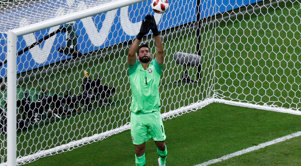 Brazil's Alisson makes a save. Photo: Reuters