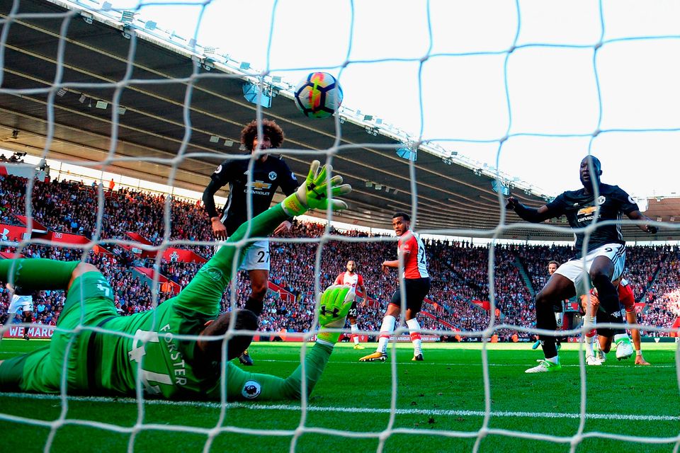 Romelu Lukaku of Manchester United scores the winning goal past Fraser Forster. Photo: Getty