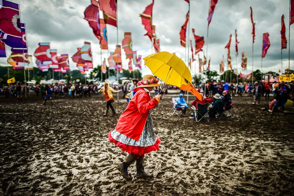 Festivalgoers enjoying the mud at the Glastonbury Festival, at Worthy Farm in Somerset (Ben Birchall/PA)