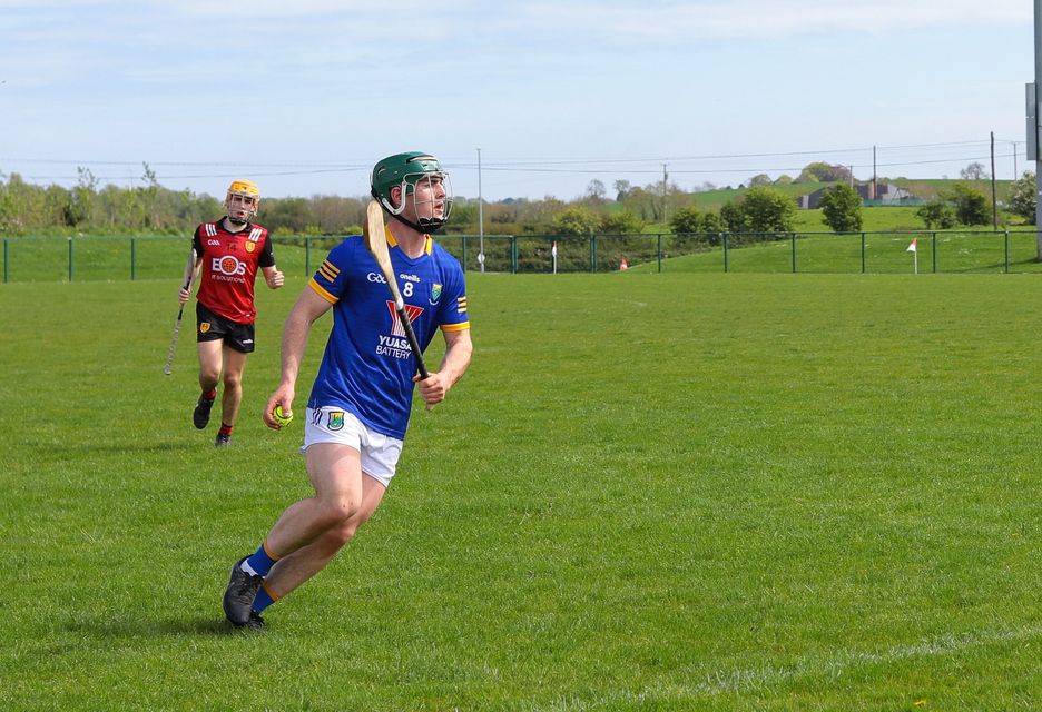 Wicklow U20 hurling captain Riain Waters looks up before firing a long pass into the full-forward line in Darver. 