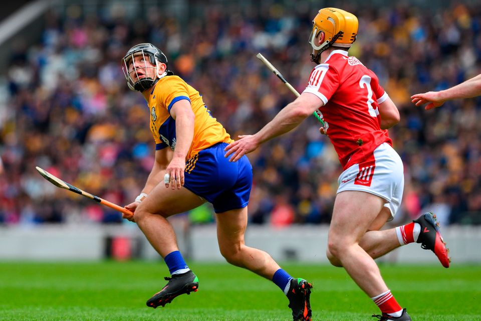 Clare's David Reidy is pursued by Cork's Niall O' Leary during the Munster SHC round 2 clash at SuperValu Páirc Uí Chaoimh in Cork. Photo: Sportsfile