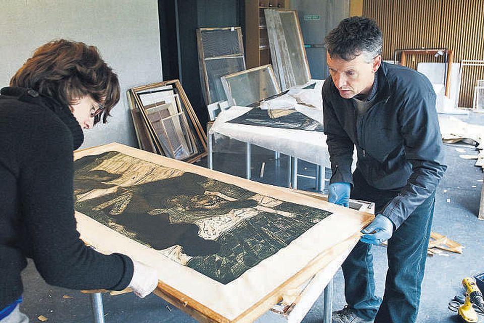 Paul Curtis, conservator in Muckross House, and Emer Towmey, UCC archivist, attempt to salvage artwork in the Glucksman Art Gallery in UCC