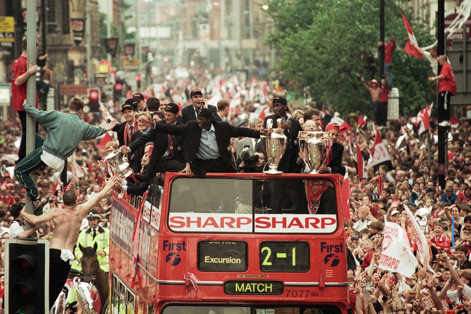 Manchester United's treble-winning side are greeted by ecstatic fans in the city. Photo: Prime Video