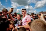 thumbnail: Seán O'Shea poses for pictures with supporters after the All-Ireland SFC Group 1 Round 3 game against Louth in Portaloise