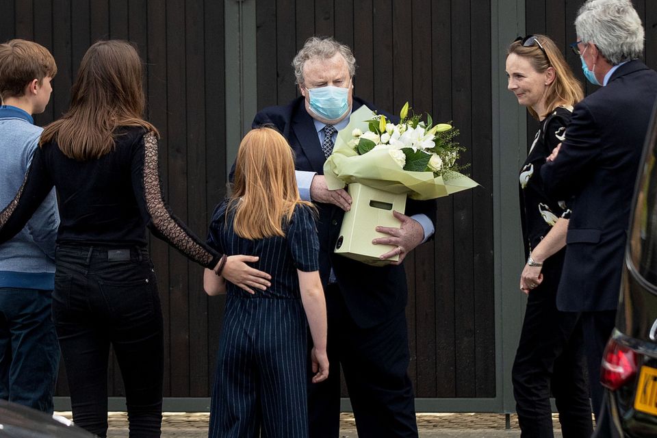 Pat’s wife Frances and the couple’s children receive a bouquet of flowers