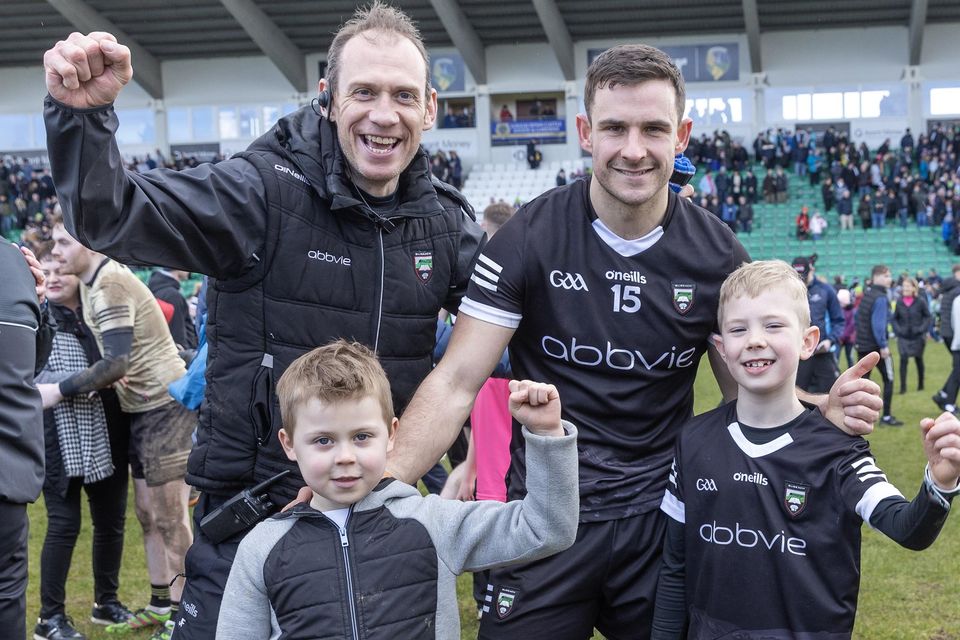 Sligo Selector Noel McGuire and Sligo captain Niall Murphy celebrate the win against Leitrim in Carrick-on-Shannon. Pic: Donal Hackett.