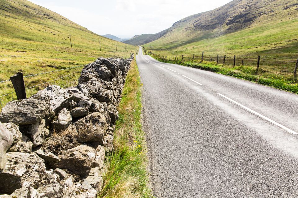 Stone walls separating a farm from a road. Photo: Getty