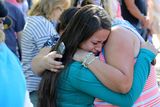 thumbnail: A woman is comforted after a shooting at Umpqua Community College (AP)