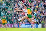 thumbnail: Jason McGee of Donegal in action against Brian Kennedy of Tyrone