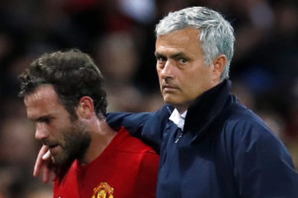 United manager Jose Mourinho puts his arm around Juan Mata after substituting him during Friday’s win over Southampton. Pic: Reuters